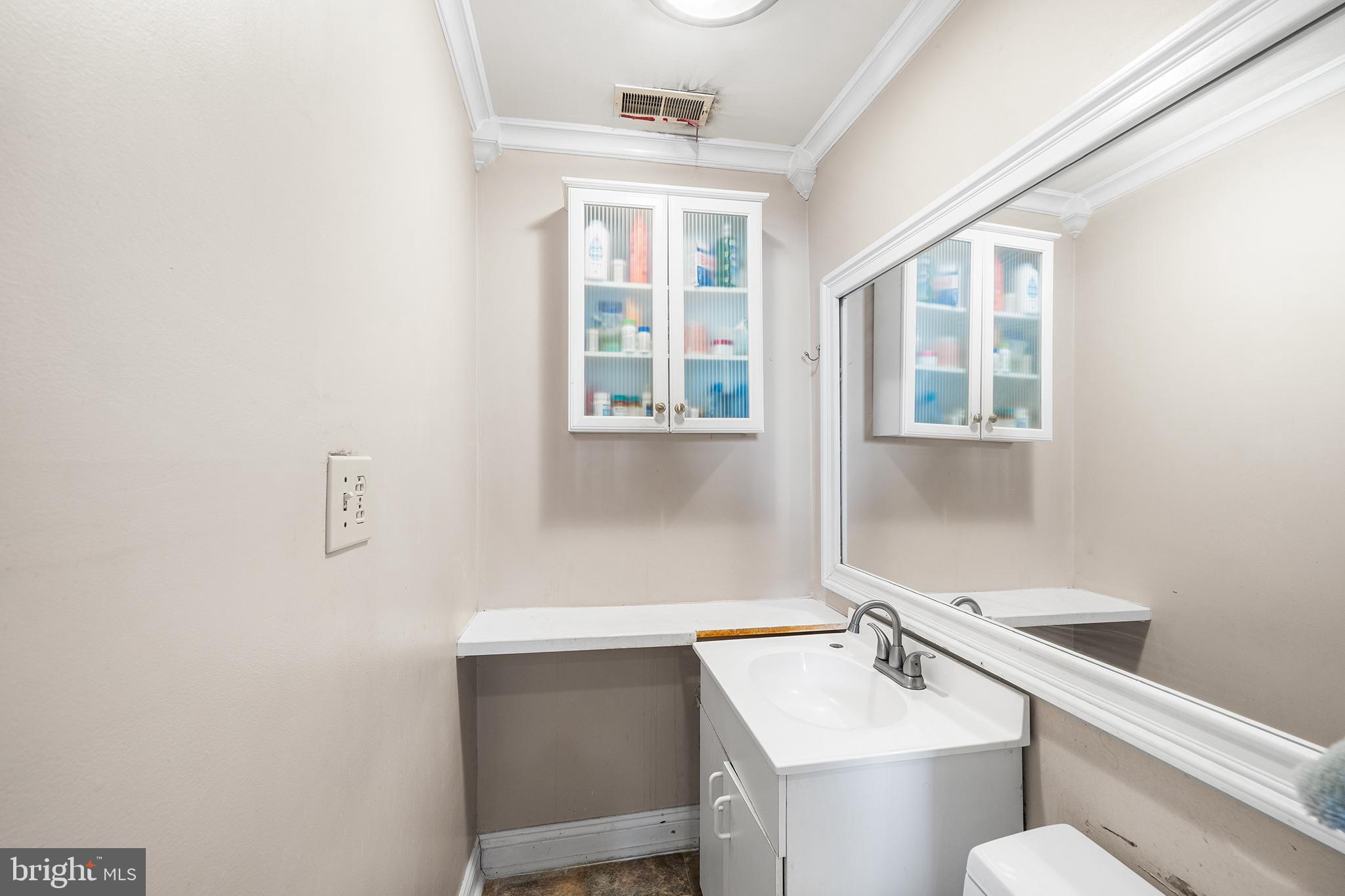 1506 East Wilt Street Philadelphia, PA 19125 - Photo 31 of 50 a bathroom with a sink and a toilet