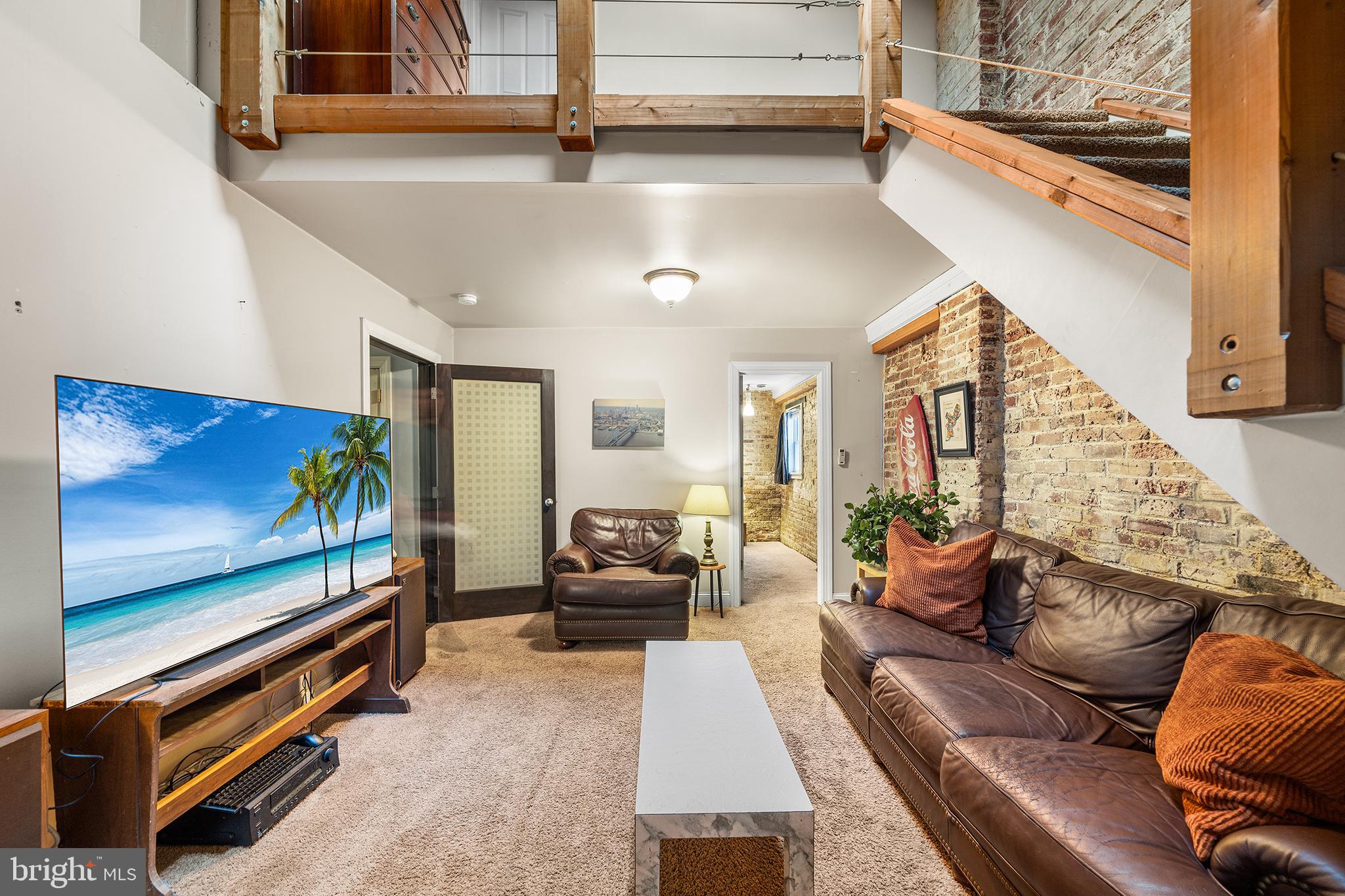 1506 East Wilt Street Philadelphia, PA 19125 - Photo 33 of 50 a living room with furniture flat screen tv