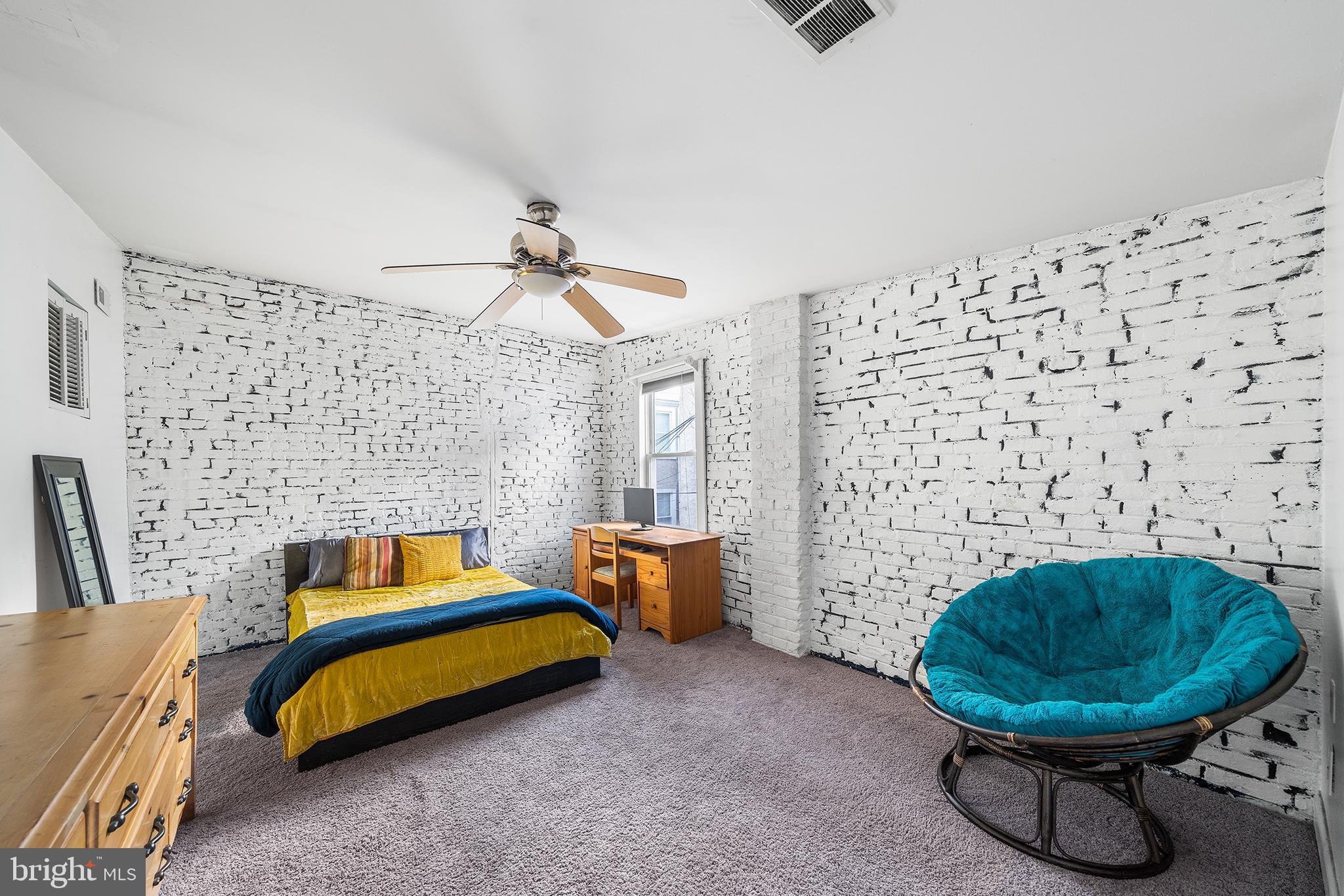 1506 East Wilt Street Philadelphia, PA 19125 - Photo 40 of 50 a bedroom with a bed and ceiling fan