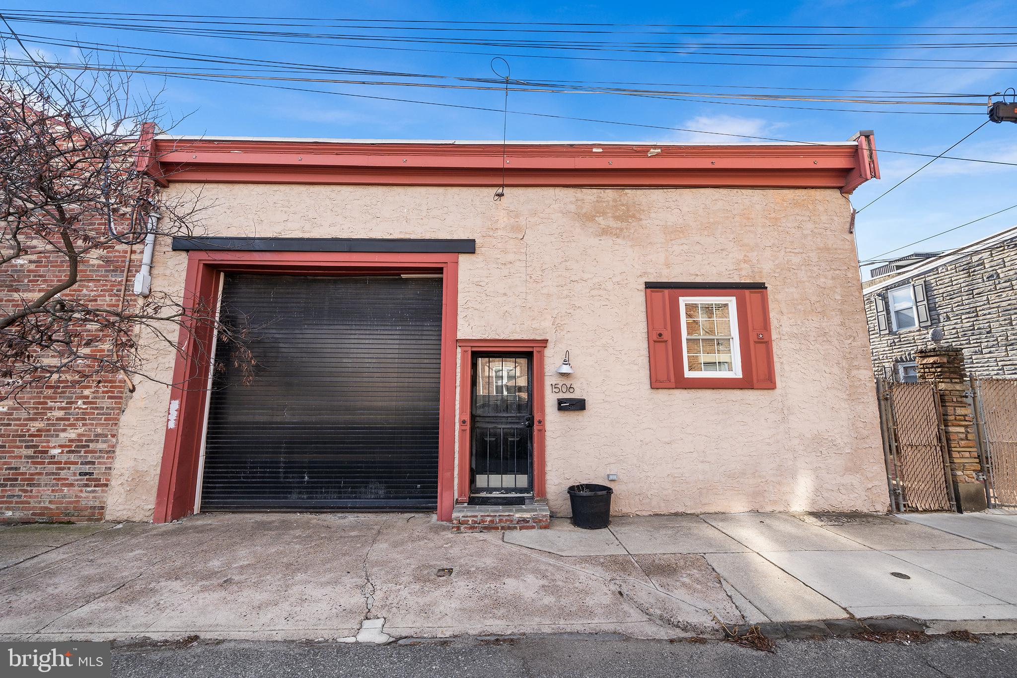 1506 East Wilt Street Philadelphia, PA 19125 - Photo 4 of 50 a front view of a house with garage