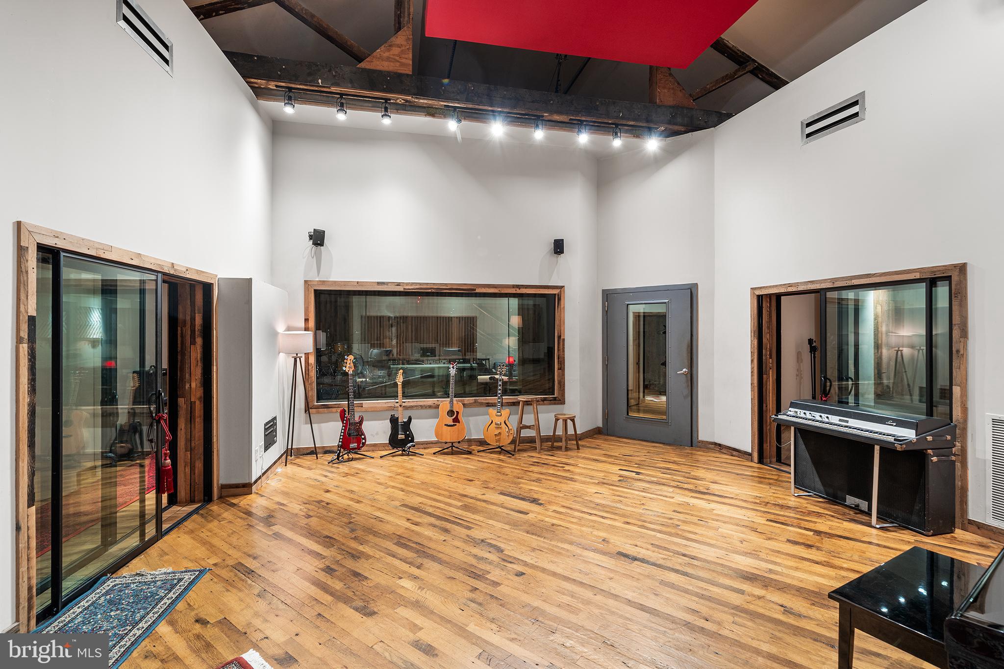 1506 East Wilt Street Philadelphia, PA 19125 - Photo 9 of 50 a room with a bed and a flat screen tv