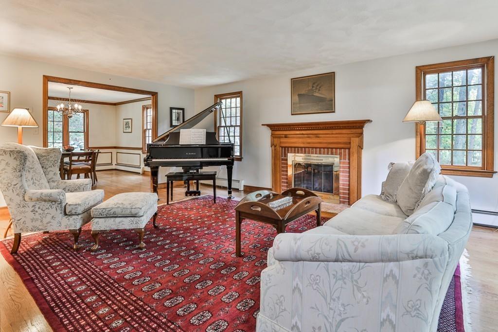 70 B Baldpate Road Boxford, MA 01921 - Photo 11 of 40 a living room with furniture and a fireplace