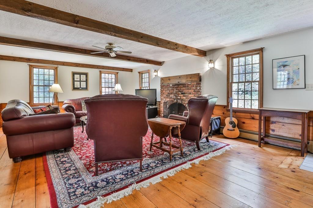 70 B Baldpate Road Boxford, MA 01921 - Photo 17 of 40 a living room with furniture and a fireplace
