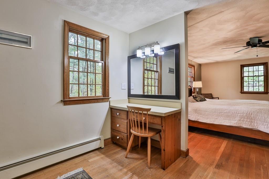 70 B Baldpate Road Boxford, MA 01921 - Photo 23 of 40 a bedroom with a bed window and table