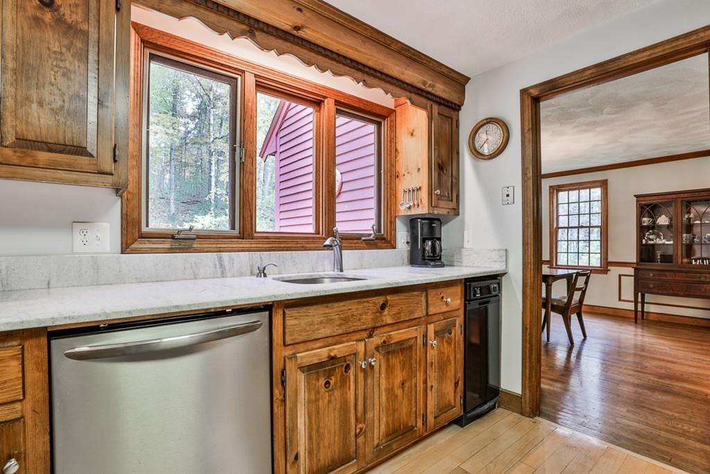 70 B Baldpate Road Boxford, MA 01921 - Photo 6 of 40 a kitchen with stainless steel appliances granite countertop a sink and cabinets with wooden floor