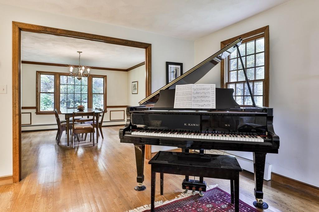 70 B Baldpate Road Boxford, MA 01921 - Photo 9 of 40 a living room with furniture a piano and a potted plant