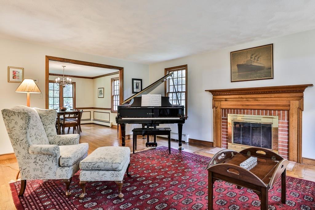 70 B Baldpate Road Boxford, MA 01921 - Photo 10 of 40 a living room with furniture a rug and a fireplace