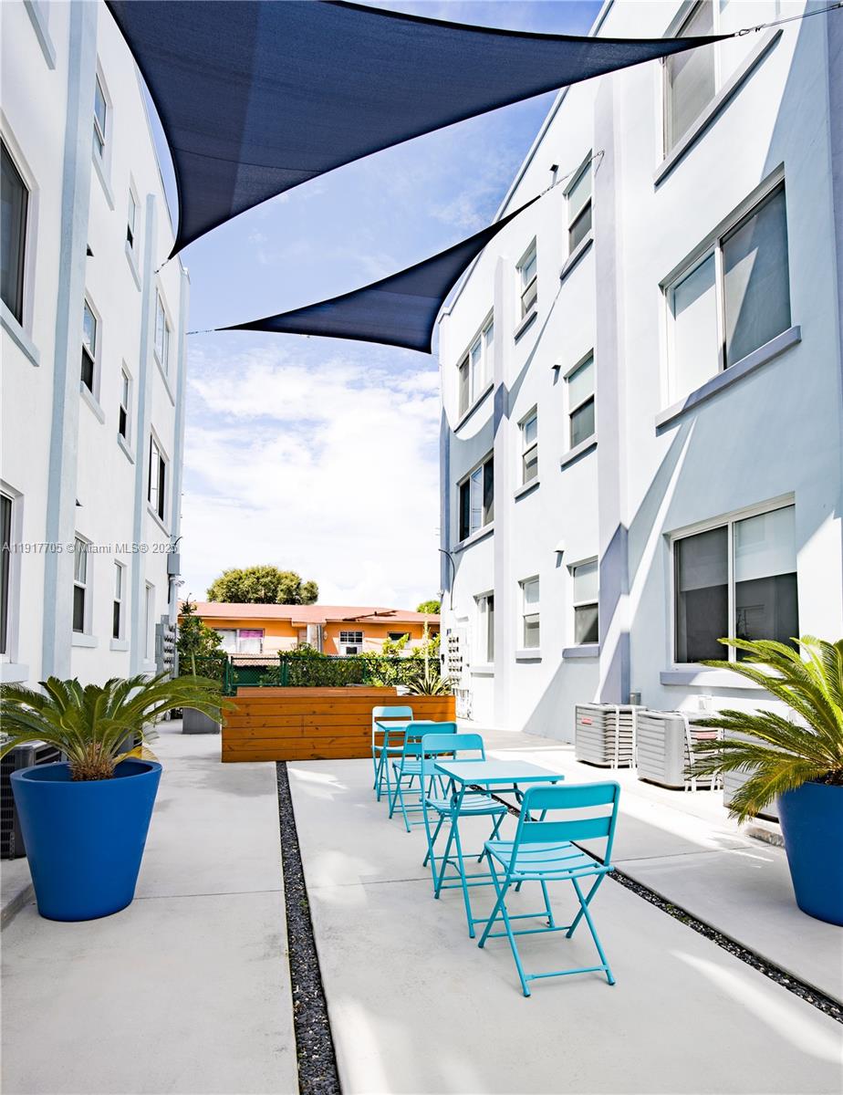 1814 Southwest 22nd Avenue, Unit 4 Miami, FL 33145 - Photo 11 of 11 a building outdoor space with patio furniture and potted plants