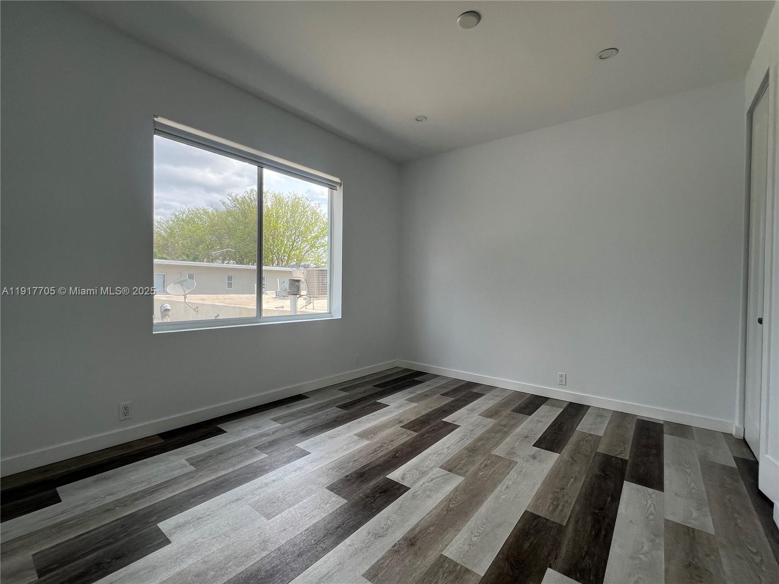 1814 Southwest 22nd Avenue, Unit 4 Miami, FL 33145 - Photo 7 of 11 a view of an empty room and window