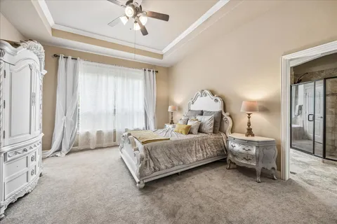 a bed room with a bed and a chandelier