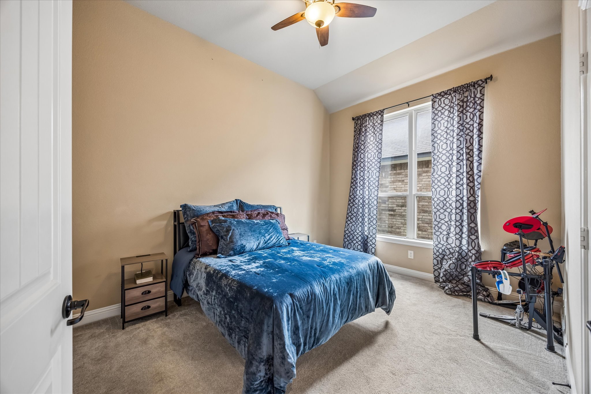 108 Rhinestone Cove Liberty Hill, TX 78642 - Photo 21 of 32 Room featuring a vaulted ceiling and a ceiling fan with integrated lighting