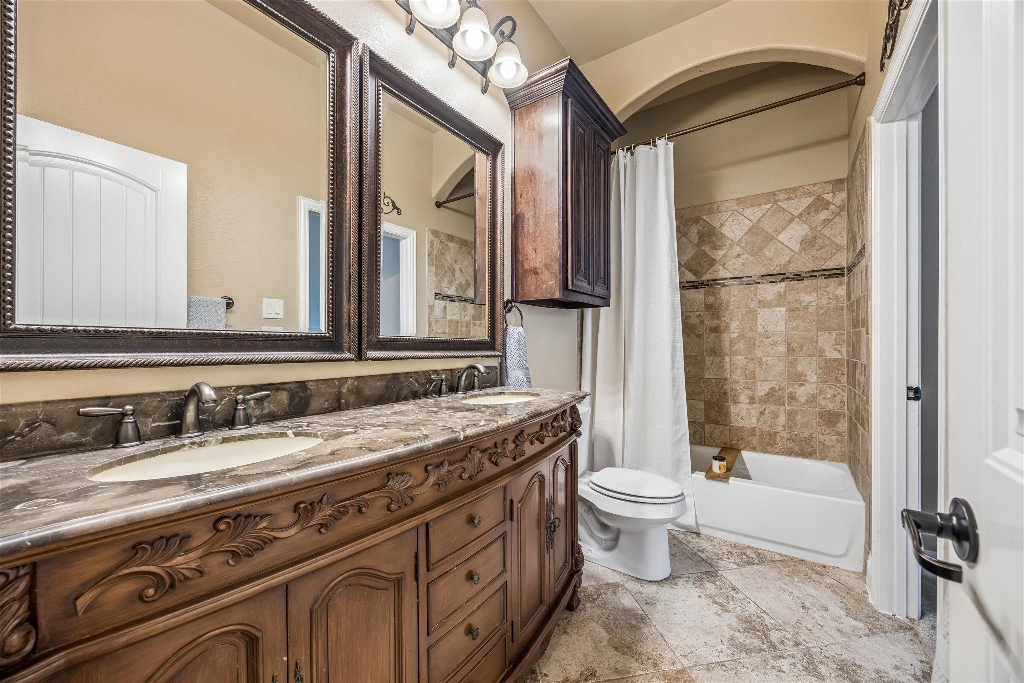 108 Rhinestone Cove Liberty Hill, TX 78642 - Photo 23 of 32 Double vanity with an ornate wood-finish base and integrated sinks