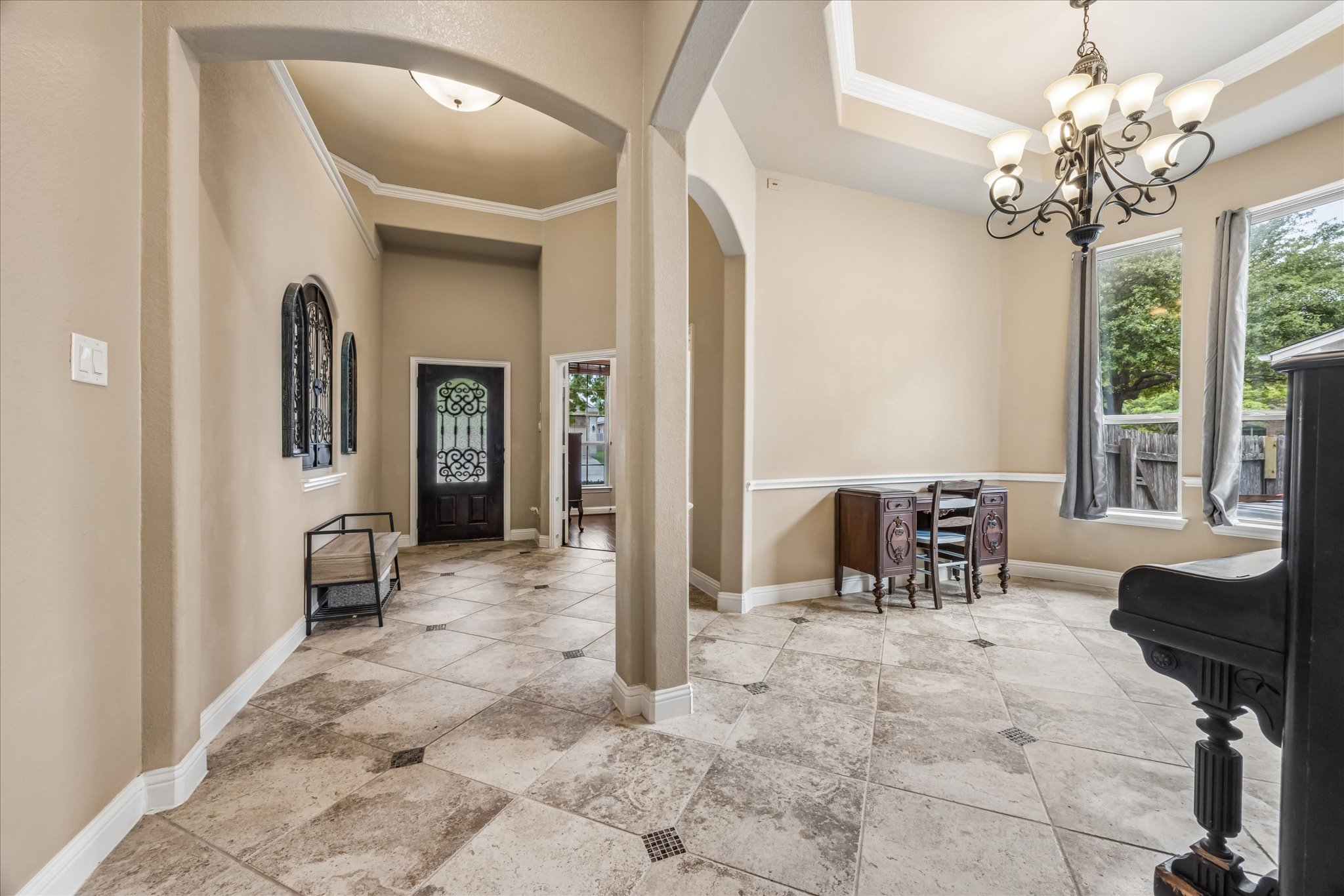 108 Rhinestone Cove Liberty Hill, TX 78642 - Photo 5 of 32 Entryway with neutral wall tones and decorative arched doorways