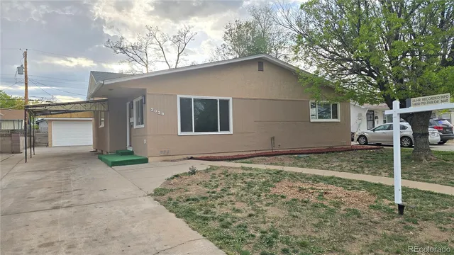 a house with trees in the background