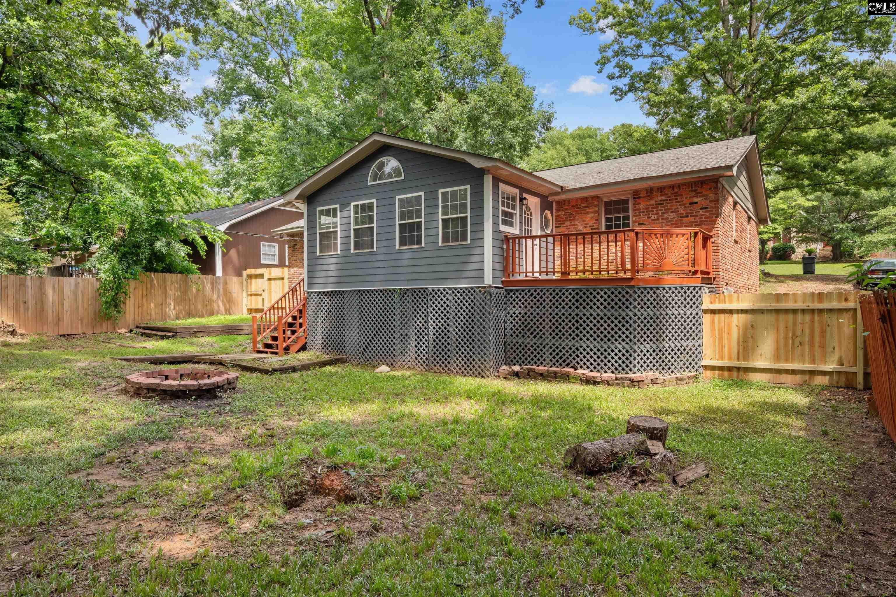 245 Piney Grove Road Columbia, SC 29210 - Photo 28 of 29 a backyard of a house with table and chairs