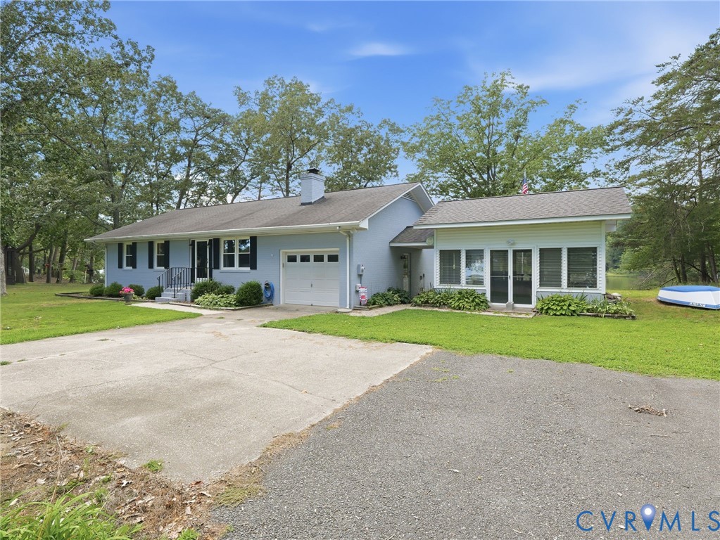 597 Harbor Drive Reedville, VA 22539 - Photo 31 of 34 Light blue exterior with dark shutters and a white