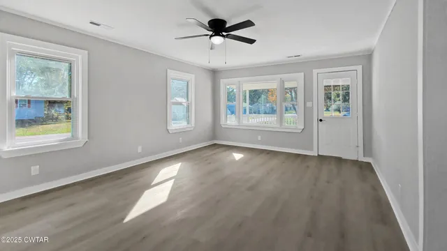 a view of an empty room with a window