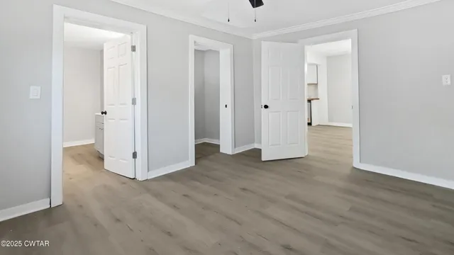 a view of a room with wooden floor