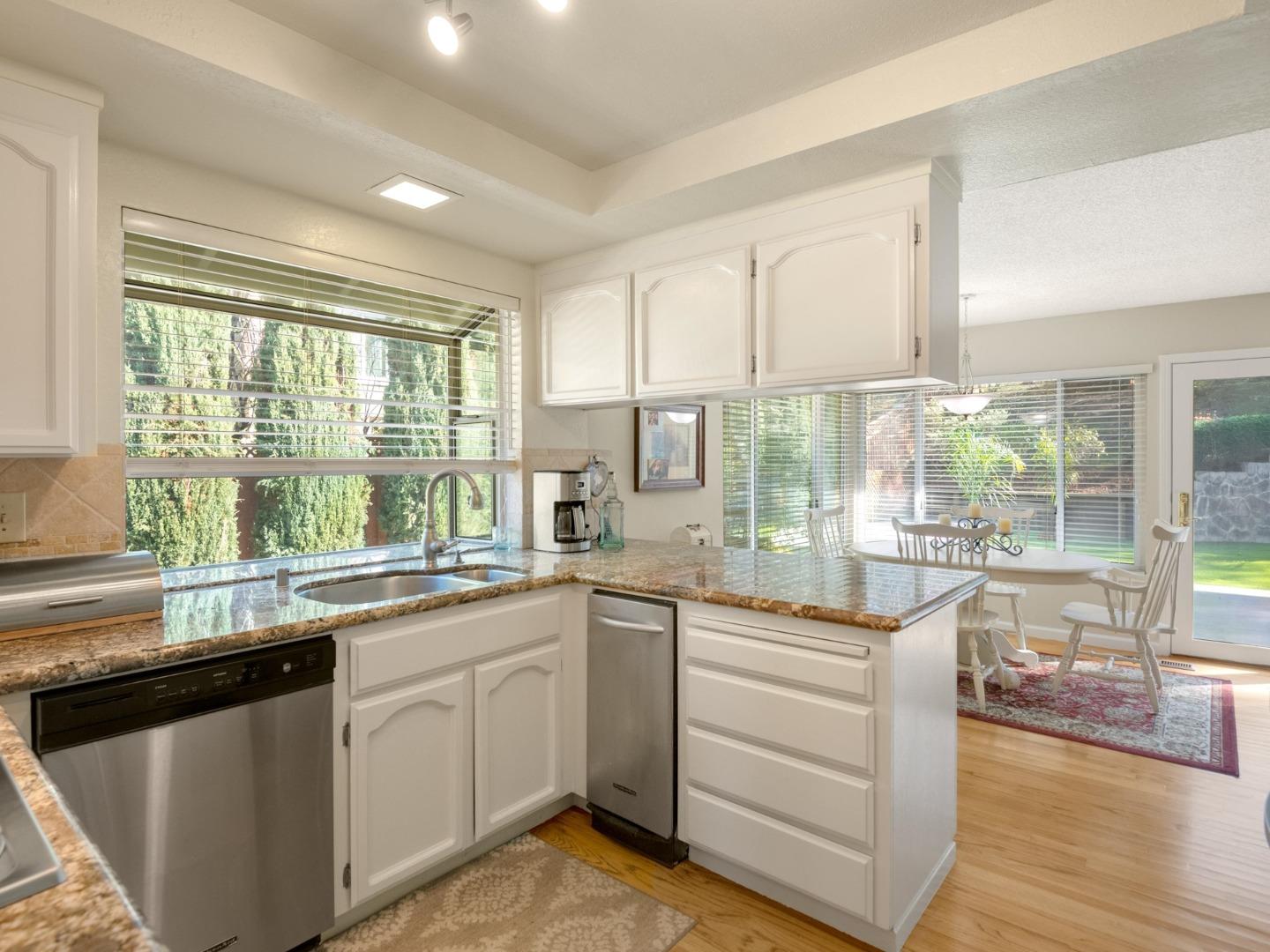 7026 Burnside Drive San Jose, CA 95120 - Photo 13 of 60 a kitchen with a sink and white cabinets
