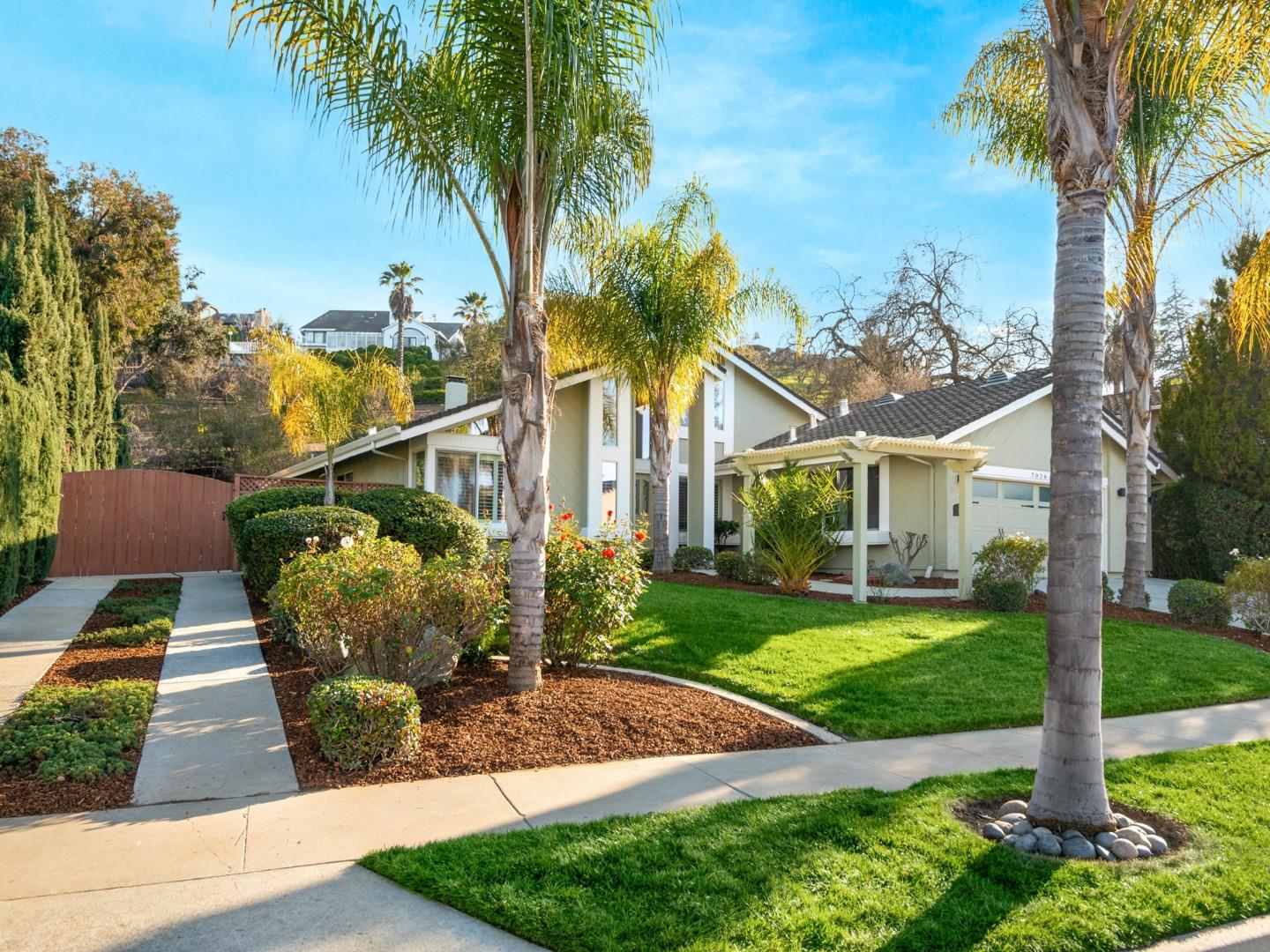 7026 Burnside Drive San Jose, CA 95120 - Photo 2 of 60 a front view of a house with garden