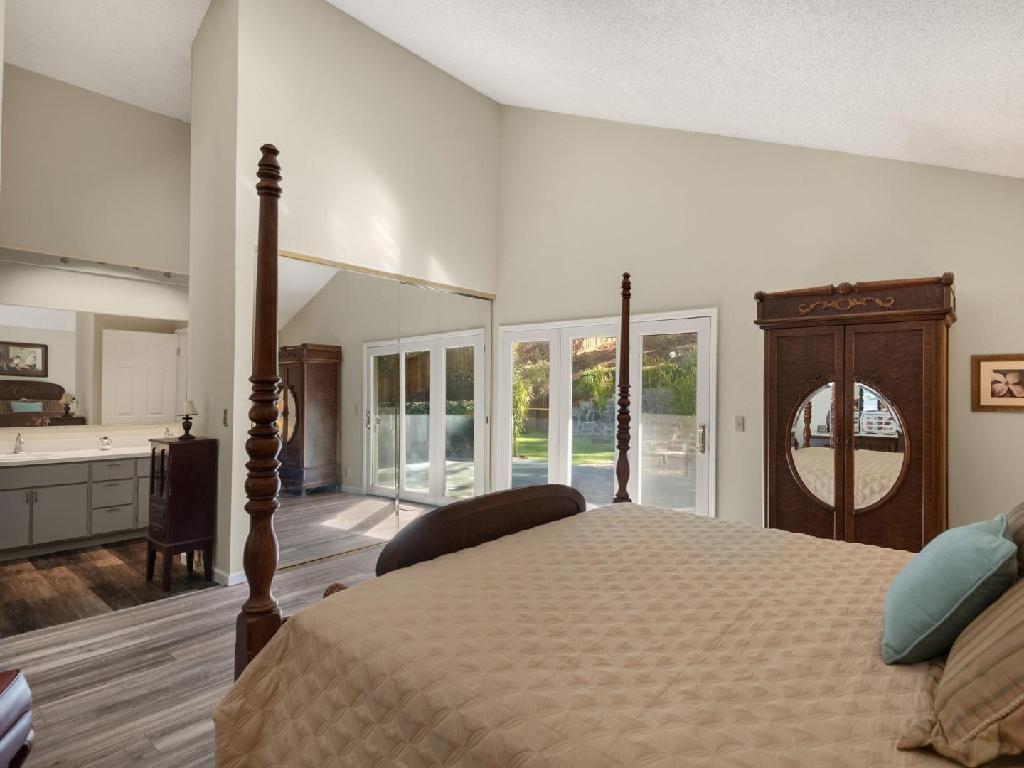 7026 Burnside Drive San Jose, CA 95120 - Photo 22 of 60 a bedroom with a bed and a large window