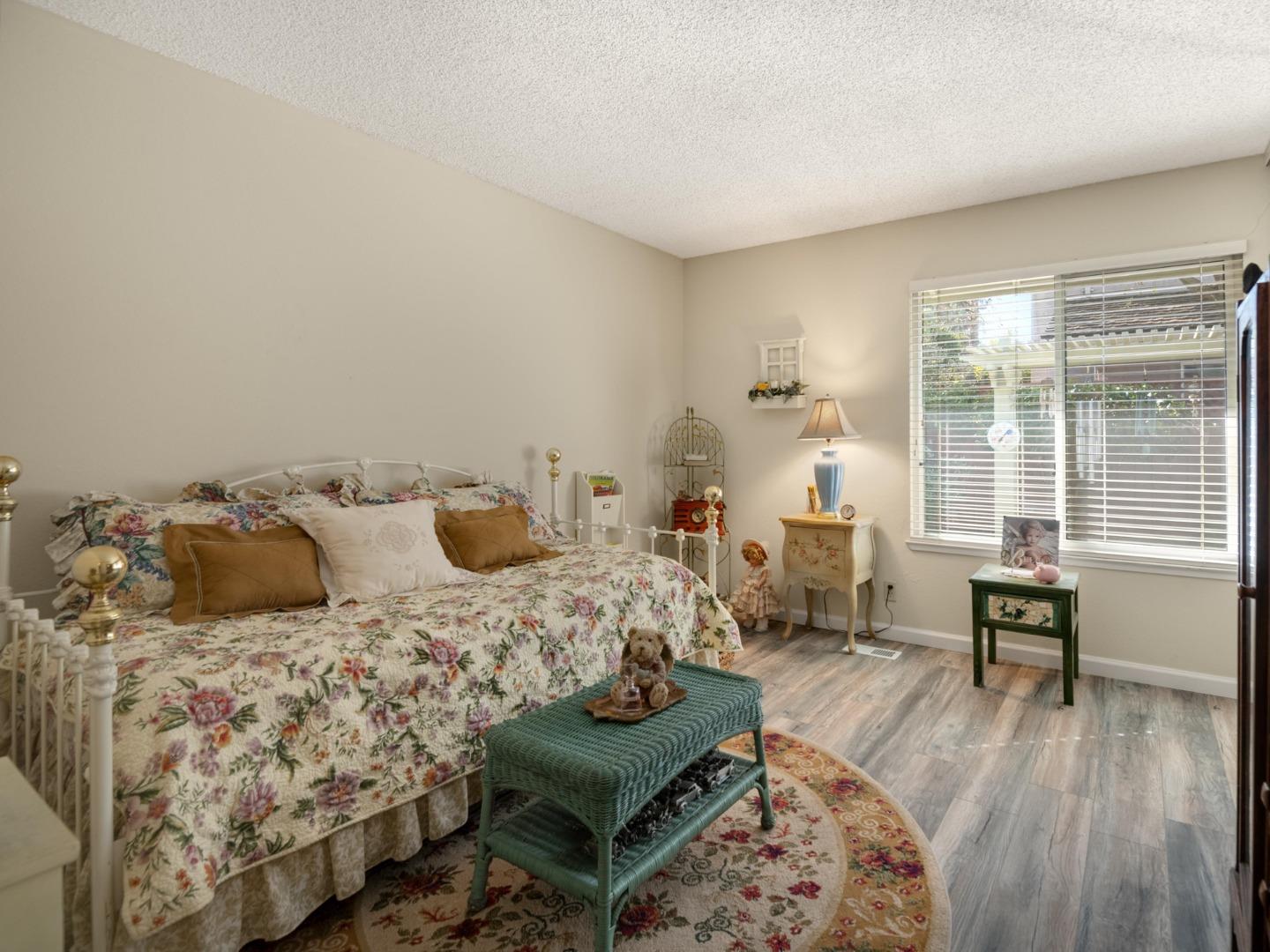 7026 Burnside Drive San Jose, CA 95120 - Photo 26 of 60 a bedroom with bed couch and window