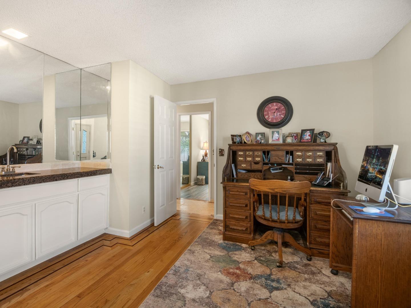7026 Burnside Drive San Jose, CA 95120 - Photo 29 of 60 a view of a center island table and chairs in a room