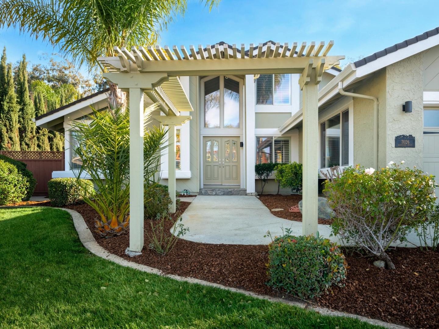 7026 Burnside Drive San Jose, CA 95120 - Photo 3 of 60 a front view of a house with garden