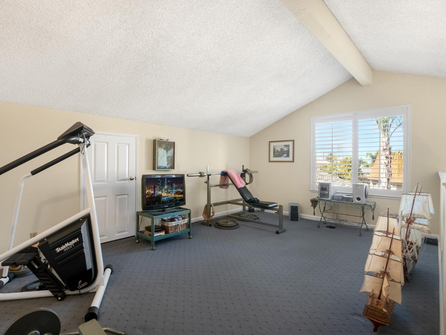7026 Burnside Drive San Jose, CA 95120 - Photo 32 of 60 a living room with furniture and a flat screen tv