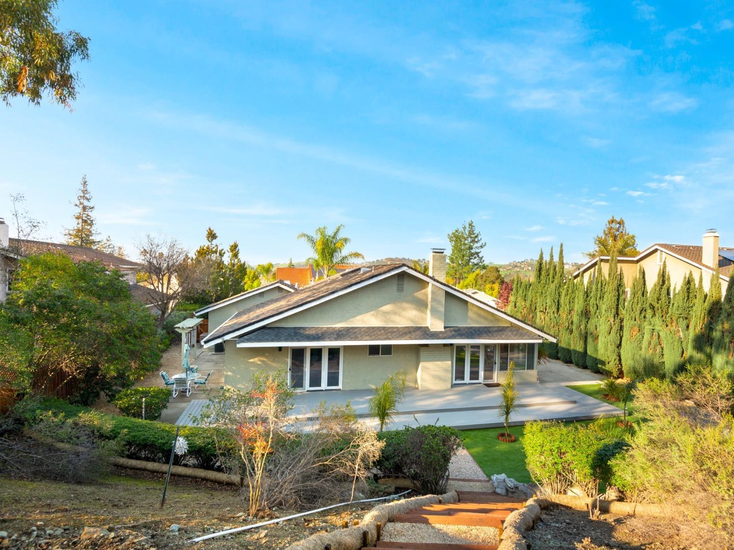 7026 Burnside Drive San Jose, CA 95120 - Photo 39 of 60 a view of a big house with a big yard and plants