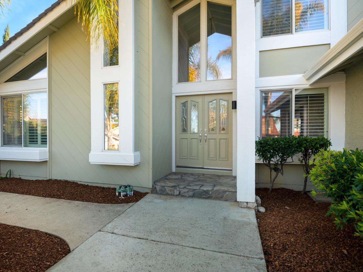7026 Burnside Drive San Jose, CA 95120 - Photo 4 of 60 a front view of a house with a yard