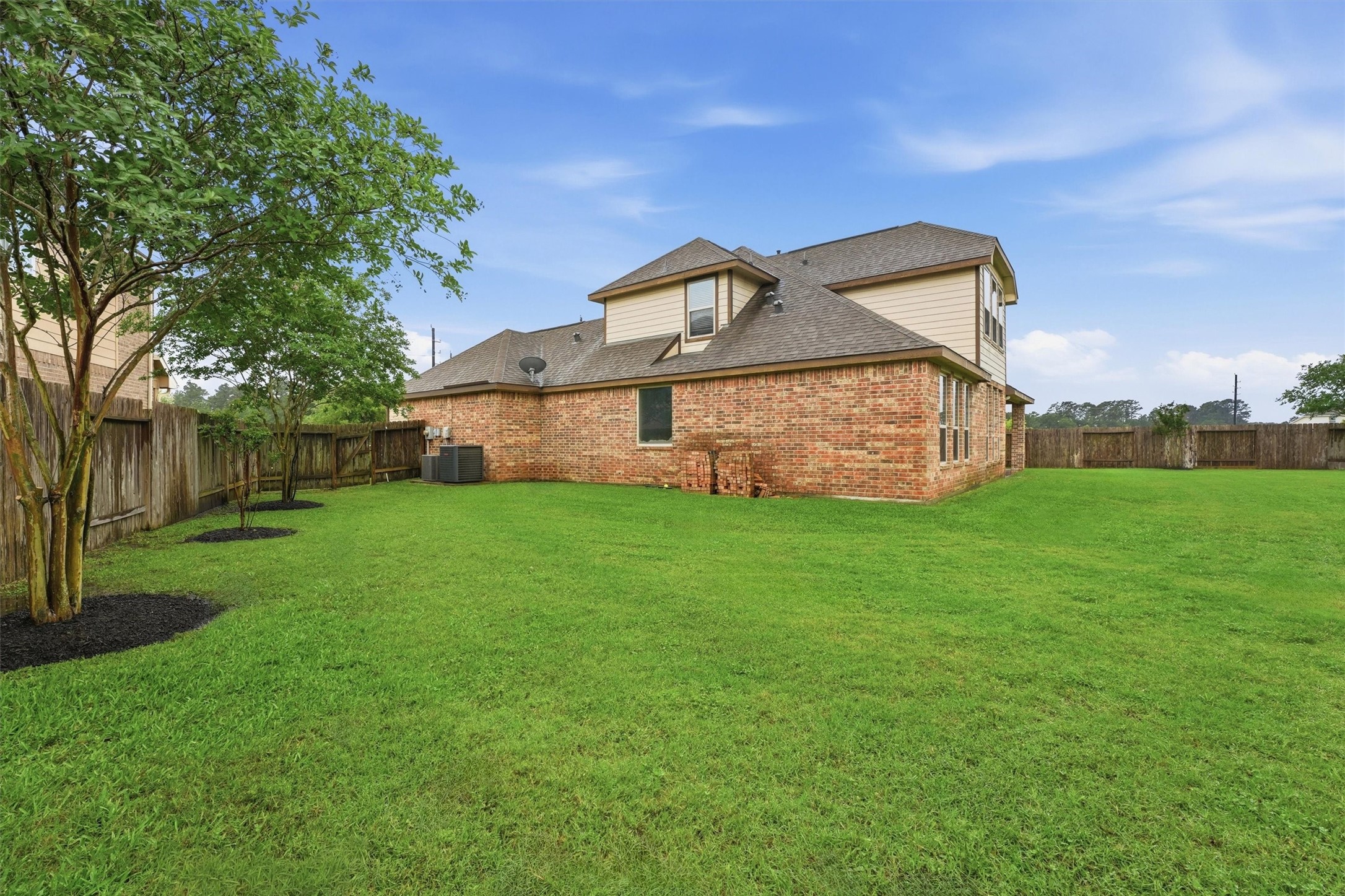 12506 Northpointe Ridge Lane Tomball, TX 77377 - Photo 28 of 31 a view of a house with a yard