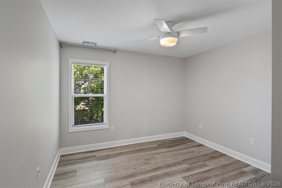 134 Huzzas Circle Cameron, NC 28326 - Photo 15 of 31 an empty room with a window and a ceiling fan