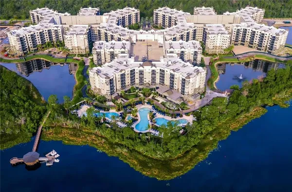 a building with swimming pool and lake view