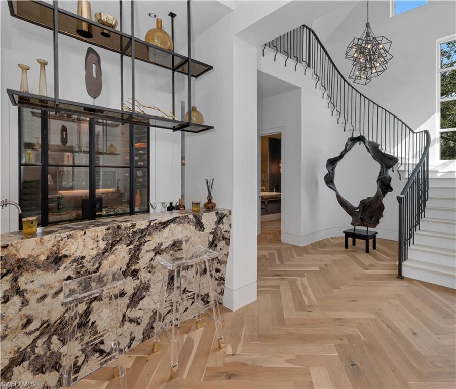 581 Myrtle Road Naples, FL 34108 - Photo 11 of 39 a view of a hallway with wooden floor and entryway