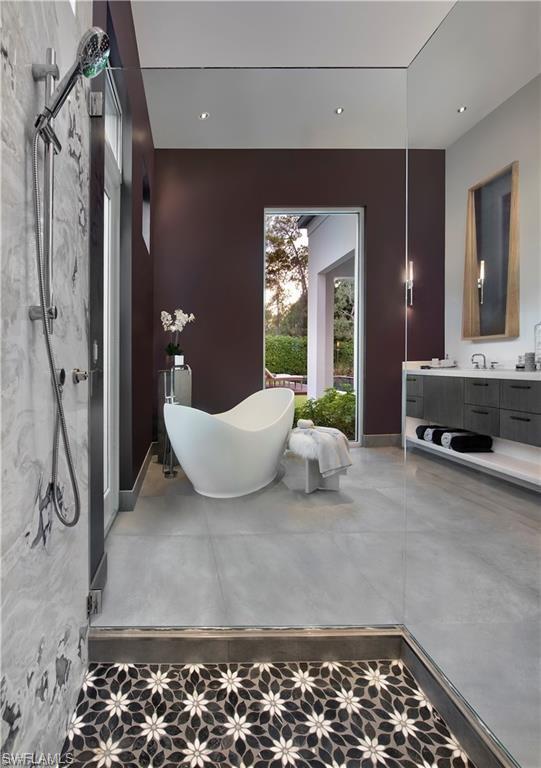 581 Myrtle Road Naples, FL 34108 - Photo 14 of 39 a living room with a couch and a chandelier