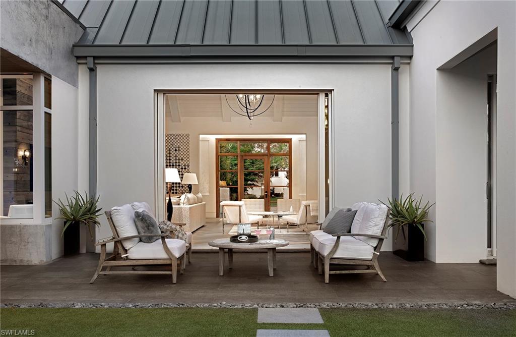 581 Myrtle Road Naples, FL 34108 - Photo 33 of 39 a living room with furniture and a potted plant