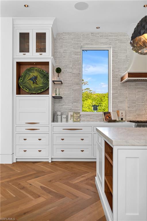 581 Myrtle Road Naples, FL 34108 - Photo 8 of 39 a view of cabinet with wooden floor