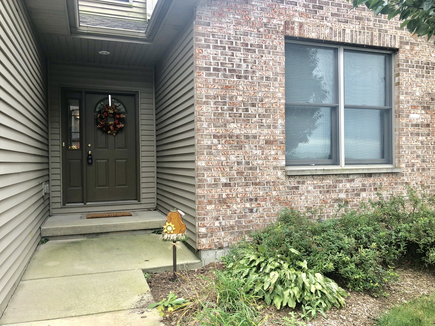 1422 Ridge Drive Sycamore, IL 60178 - Photo 19 of 21 a view of house with window and wooden fence