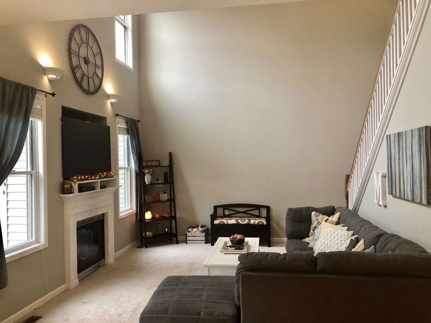 1422 Ridge Drive Sycamore, IL 60178 - Photo 3 of 21 a living room with furniture a flat screen tv and a fireplace