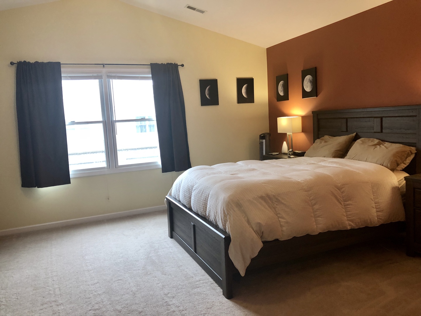 1422 Ridge Drive Sycamore, IL 60178 - Photo 9 of 21 a bed sitting in a bedroom next to a window