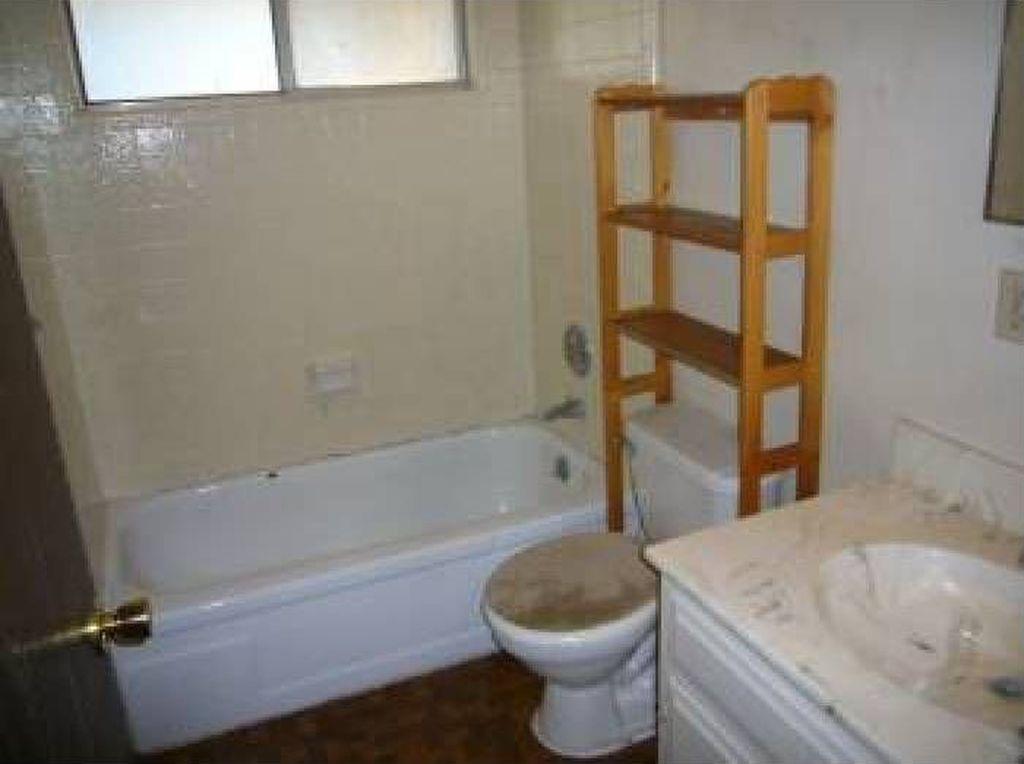 712 Main Street, Unit C Roseville, CA 95678 - Photo 2 of 8 a bathroom with a sink a toilet and shower