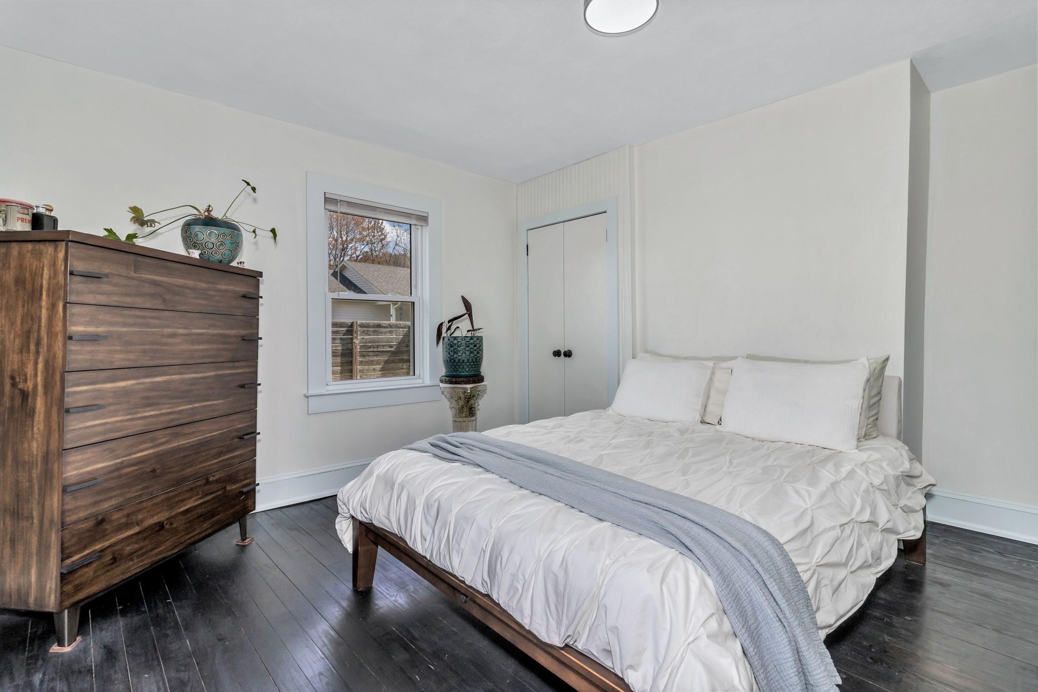 994 Riceville Road Asheville, NC 28805 - Photo 20 of 45 a bedroom with a bed and a dresser