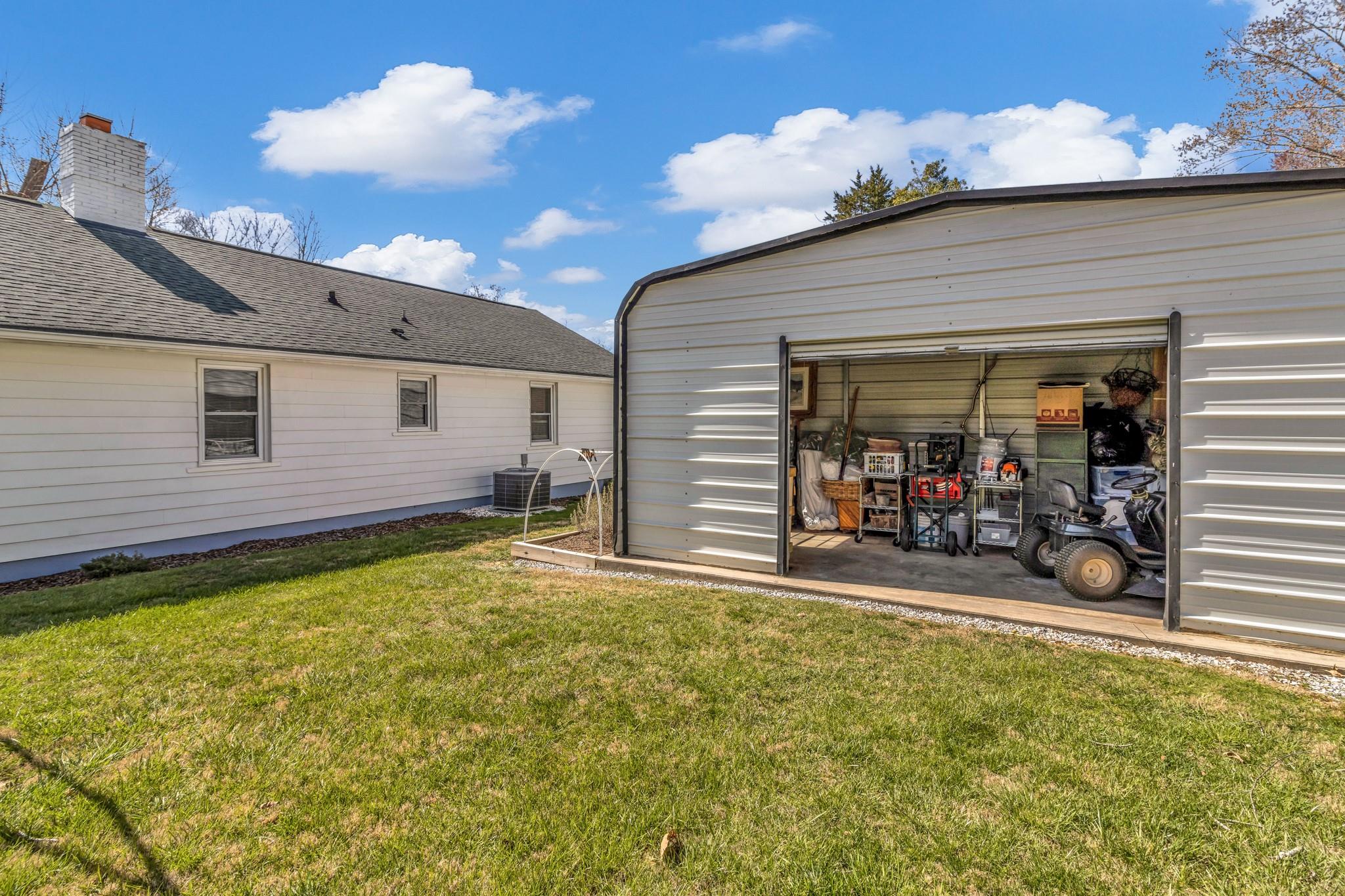 994 Riceville Road Asheville, NC 28805 - Photo 22 of 45 a view of a house with porch and furniture