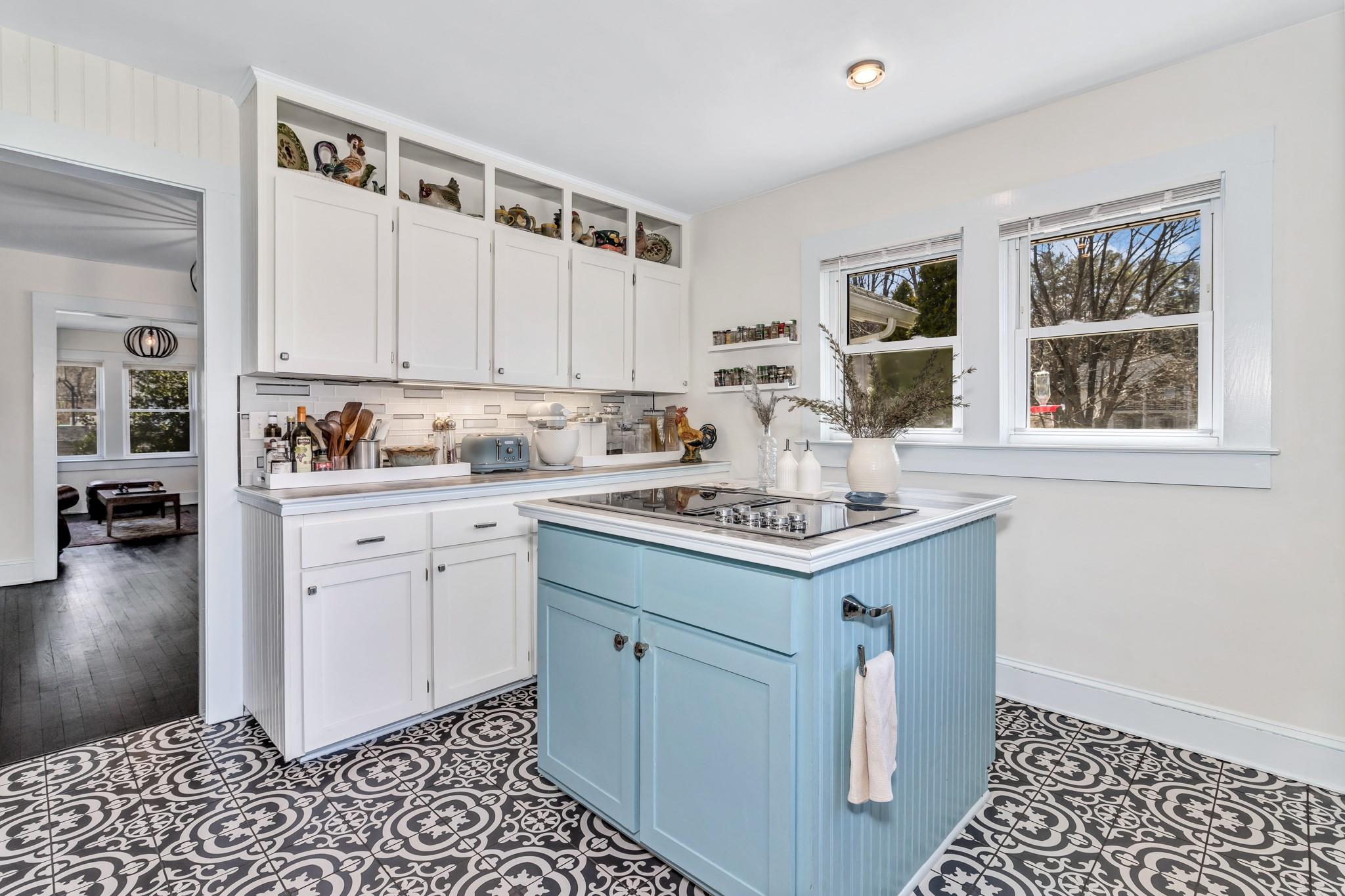 994 Riceville Road Asheville, NC 28805 - Photo 27 of 45 a kitchen with a stove a sink and a window