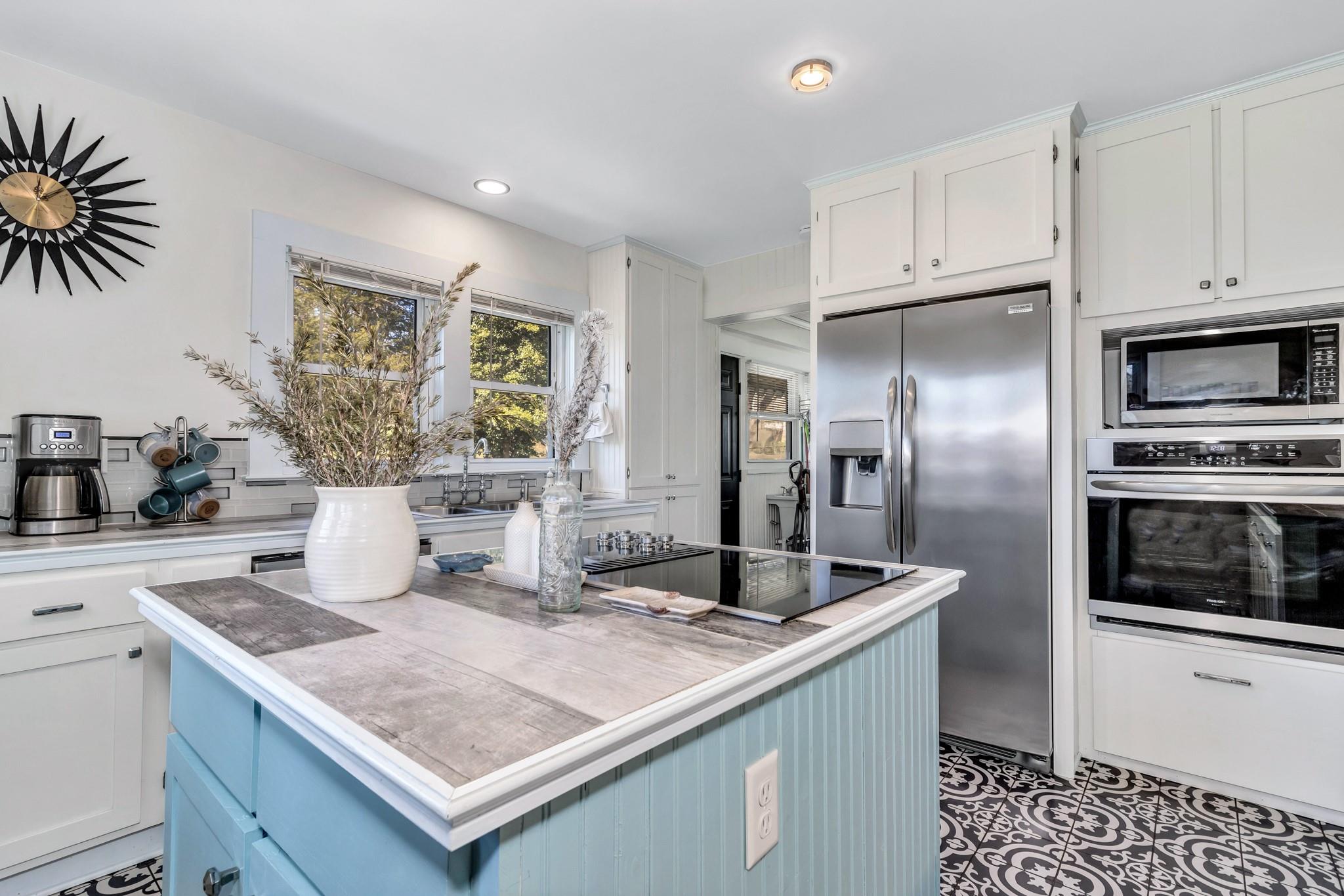 994 Riceville Road Asheville, NC 28805 - Photo 28 of 45 a kitchen with stainless steel appliances granite countertop a sink and a refrigerator