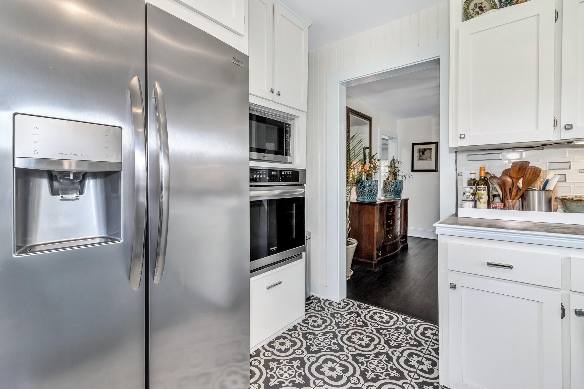 994 Riceville Road Asheville, NC 28805 - Photo 29 of 45 a kitchen with stainless steel appliances kitchen island granite countertop a refrigerator and a sink
