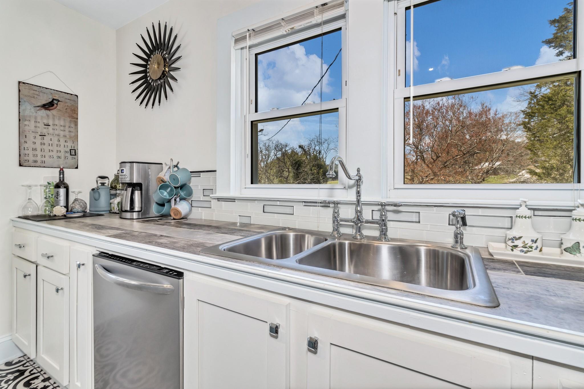 994 Riceville Road Asheville, NC 28805 - Photo 30 of 45 a kitchen with a sink and a window