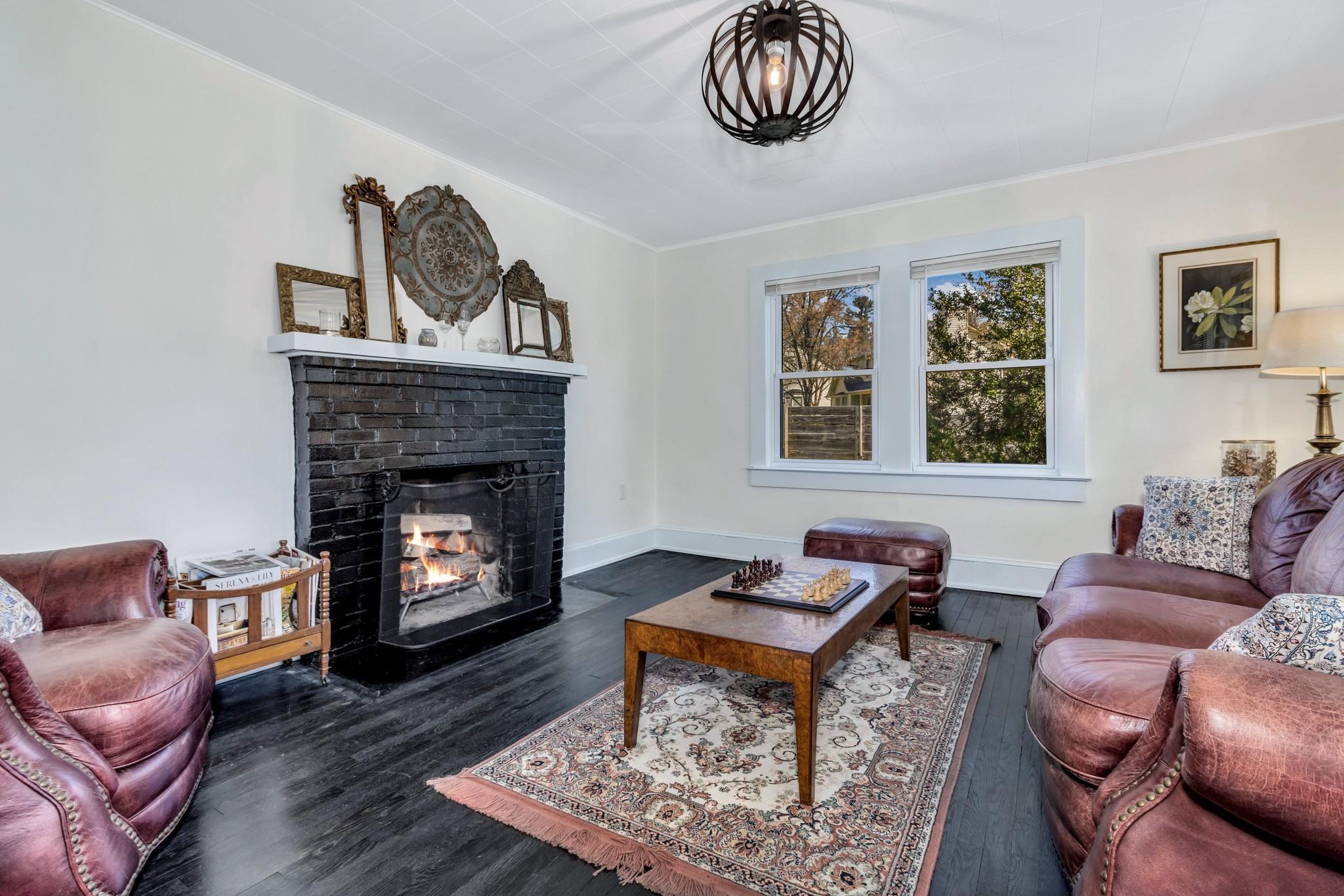 994 Riceville Road Asheville, NC 28805 - Photo 34 of 45 a living room with furniture a couch and a fireplace