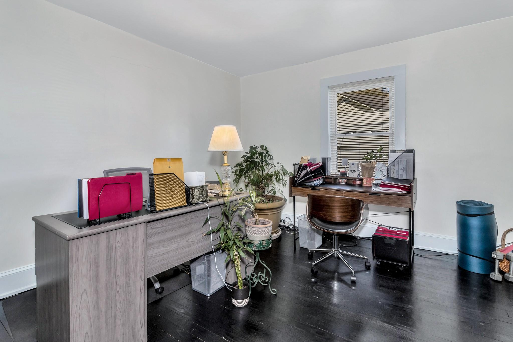 994 Riceville Road Asheville, NC 28805 - Photo 40 of 45 a room with furniture and a wooden floor